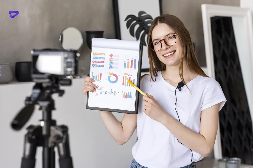 young blogger recording with professional camera holding clipboard with graphics copy