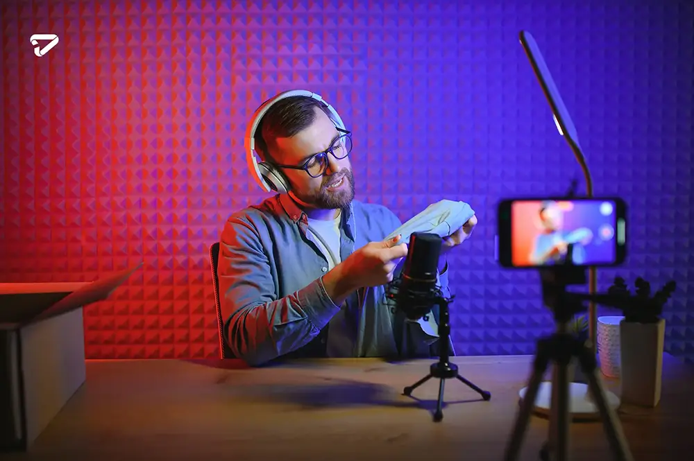 young man recording streaming podcast using microphone his small