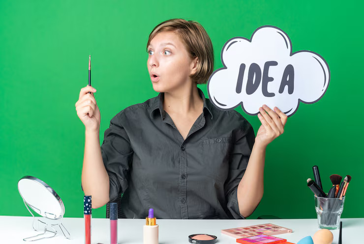 surprised beautiful woman sits table with makeup tools holding idea bubble with makeup brush 141793 122825
